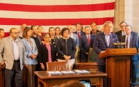 Gov. Jim Pillen is joined by two dozen lawmakers for a news conference at the end of the Legislature’s special session to address property taxes that begin almost one month prior, Aug. 20, 2024. 
(Zach Wendling / Nebraska Examiner)
