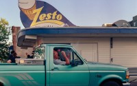 A pickup truck pulls into the drive-thru at Zesto in Omaha’s Florence neighborhood. Opened in 1953, the shop is Omaha’s only original Zesto location still in business. 
(Brock Stillmunks / Flatwater Free Press)