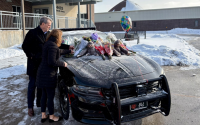 Nebraska Gov. Jim Pillen and First Lady Suzanne Pillen pay their respects at the cruiser of fallen Nebraska State Patrol trooper Kyle McAcy in the Troop A Headquarters parking lot in Omaha. 
(Courtesy of the Governor’s Office)