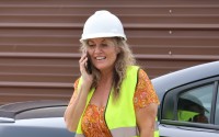 Annette Brower, Kimball city administrator, takes a call while at the Kimball Municipal Wastewater Treatment plant in Kimball, Nebraska. 
(Irene North / Flatwater Free Press)
