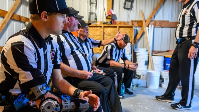 From left: referees Sam Roberts, Mike Hagge, Matt Hagge, Joshua Adams and J.D. Koerner talk during halftime of a football game on Aug. 28 in Laurel. At the age of 20, Roberts is believed to be the youngest full-time varsity high school football official in Nebraska.
(Darin Epperly / Flatwater Free Press)