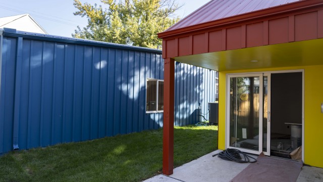 Two small houses, developed by Partners for Livable Omaha and University of Nebraska-Lincoln architecture students, have been built in Omaha’s Benson neighborhood. It’s not uncommon for passersby to stop and take photos of the striking homes.
(Lily Smith / Flatwater Free Press)