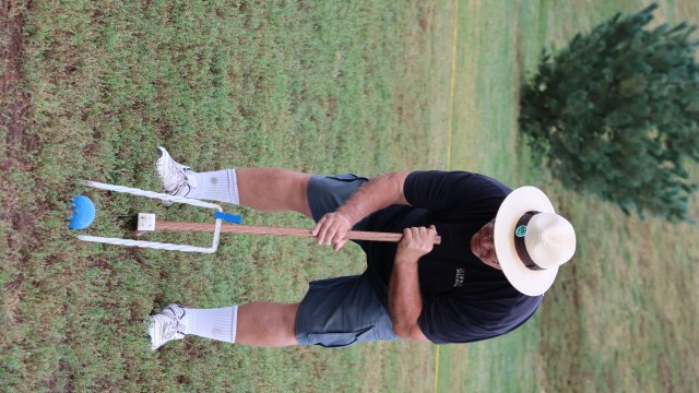 Brian Brigham, who founded the Omaha Croquet Club, watches as a ball rolls through a wicket.
(Tim Trudell / The Daily Record)