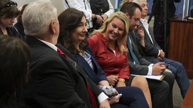 Clifford Frost, from left: Amy Facchinello, Meshawn Maddock, an unidentified attorney and Hank Choate appear during a district court hearing where a Michigan judge dismissed the criminal cases against 15 people accused of acting falsely as electors for President Donald Trump in the 2020 election Tuesday, Sept. 9, 2025 in Lansing, Mich.
 (Paul Sancya / AP Photo)