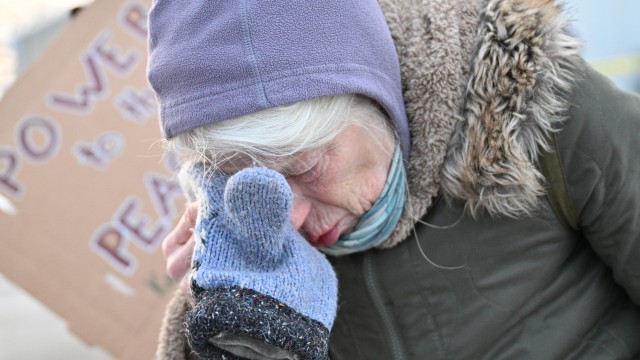 A protester covers their eyes after confronting law enforcement outside the Bishop Henry Whipple Federal Building, Thursday, Jan. 8, 2026, in Minneapolis, Minn.
(Tom Baker / AP Photo)