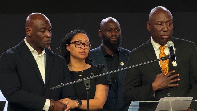 In this photo taken with a smartphone, Ben Crump (right) an attorney for the family of Nolan Wells, speaks at a news conference in Stonecrest, Ga., Thursday, Sept. 22, 2026, accompanied by Wells' parents, Elmore and Christine Wonsley.
(Emilie Megnien / AP Photo)