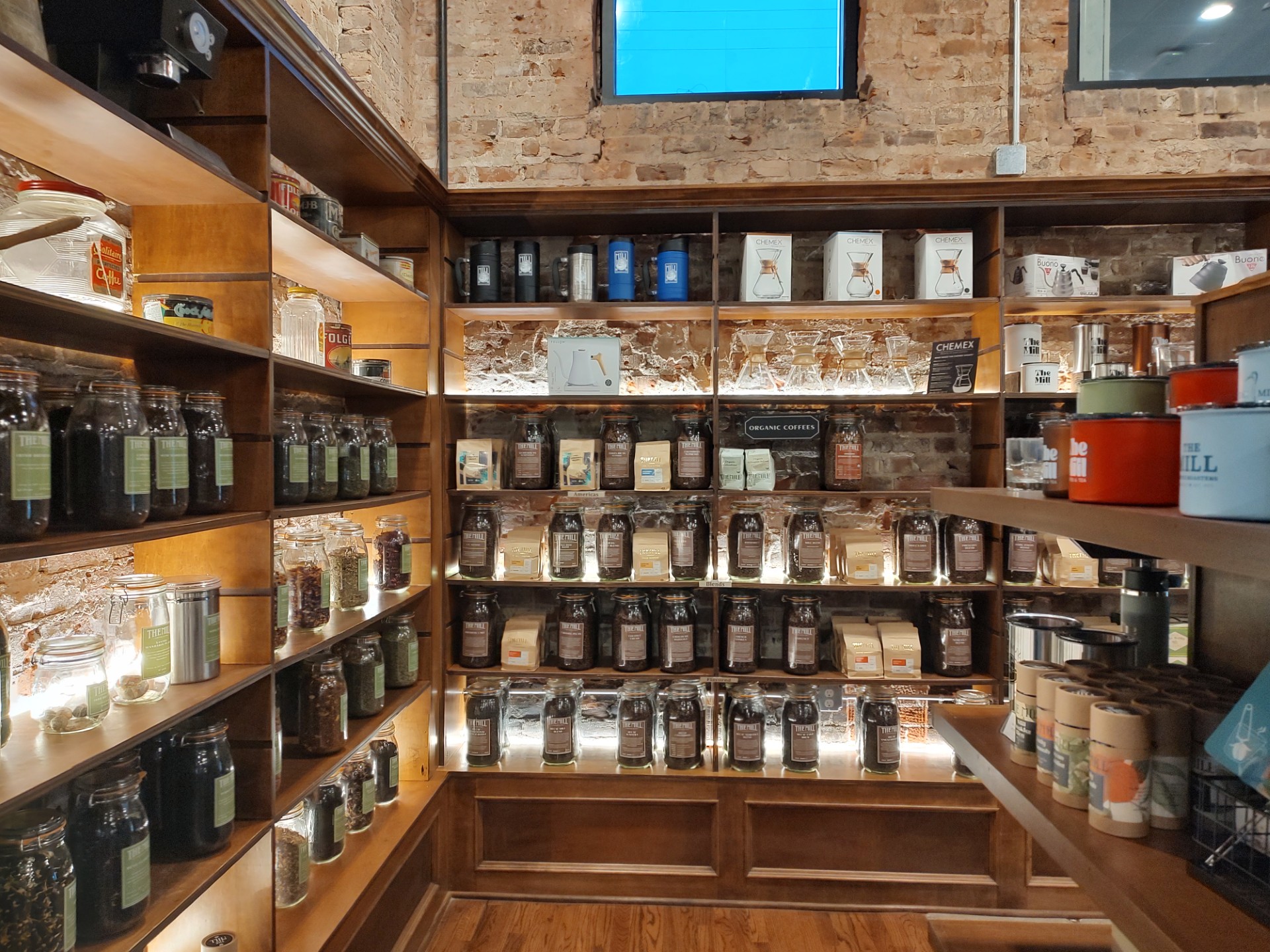 The coffee and tea selection at The Mill, set into a well-lit display. (For tea you take up the container you want to the front counter and they bag it for you!)<br />(Austin Petak / The Daily Record)