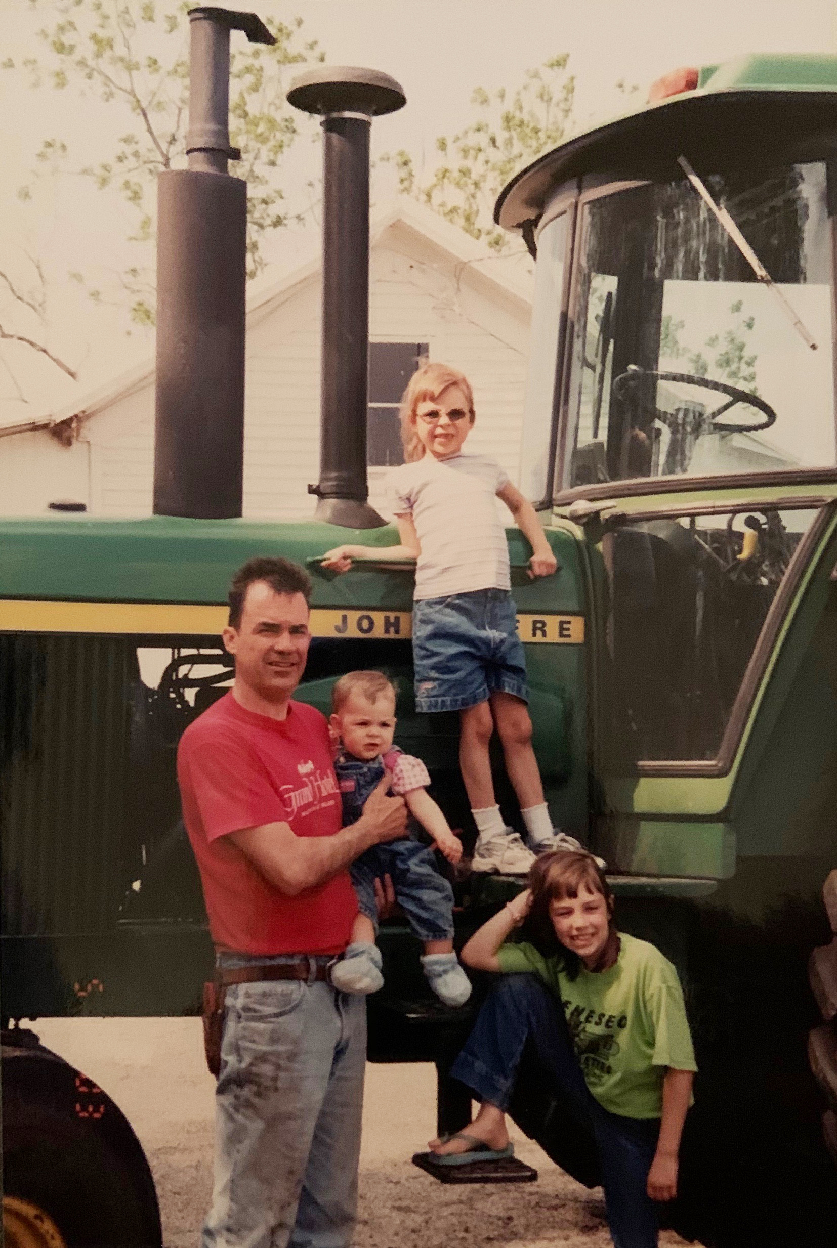 Tim Yerkey with his daughters Emma (baby), Claire (on top step), and Allison Yerkey (on bottom step) at their family farm.<br />(Photo courtesy of Emma Yerkey)
